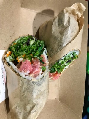 a sandwich with meat and vegetables