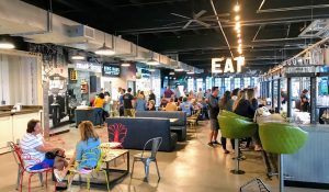 a group of people sitting at a table in a room