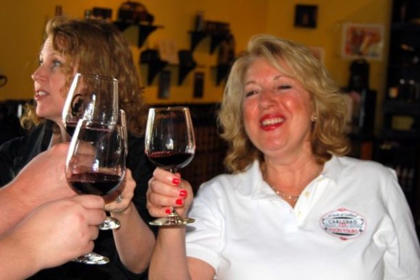 a person holding a wine glass