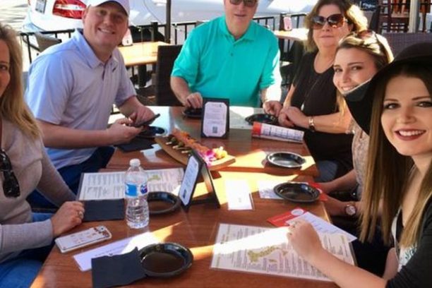 a group of people sitting at a table