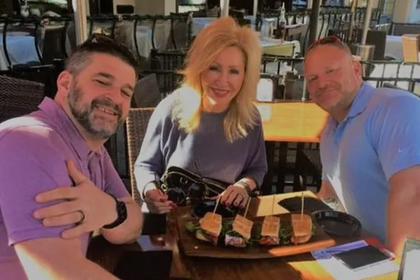 a group of people sitting at a table