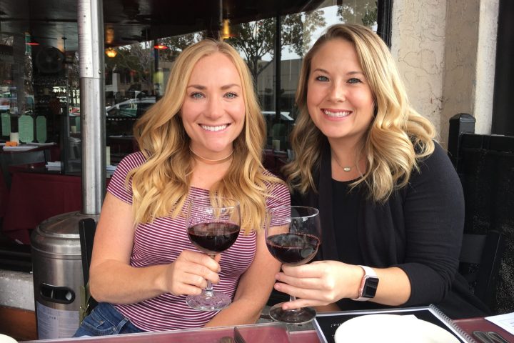 a woman sitting at a table in a restaurant