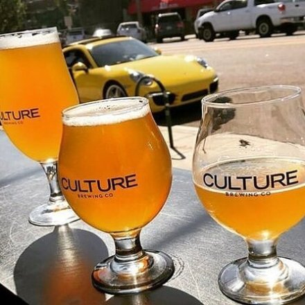 a glass of orange juice next to a cup of coffee