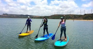 a person riding on the back of a boat in a body of water