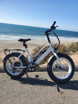 a motorcycle parked next to a body of water