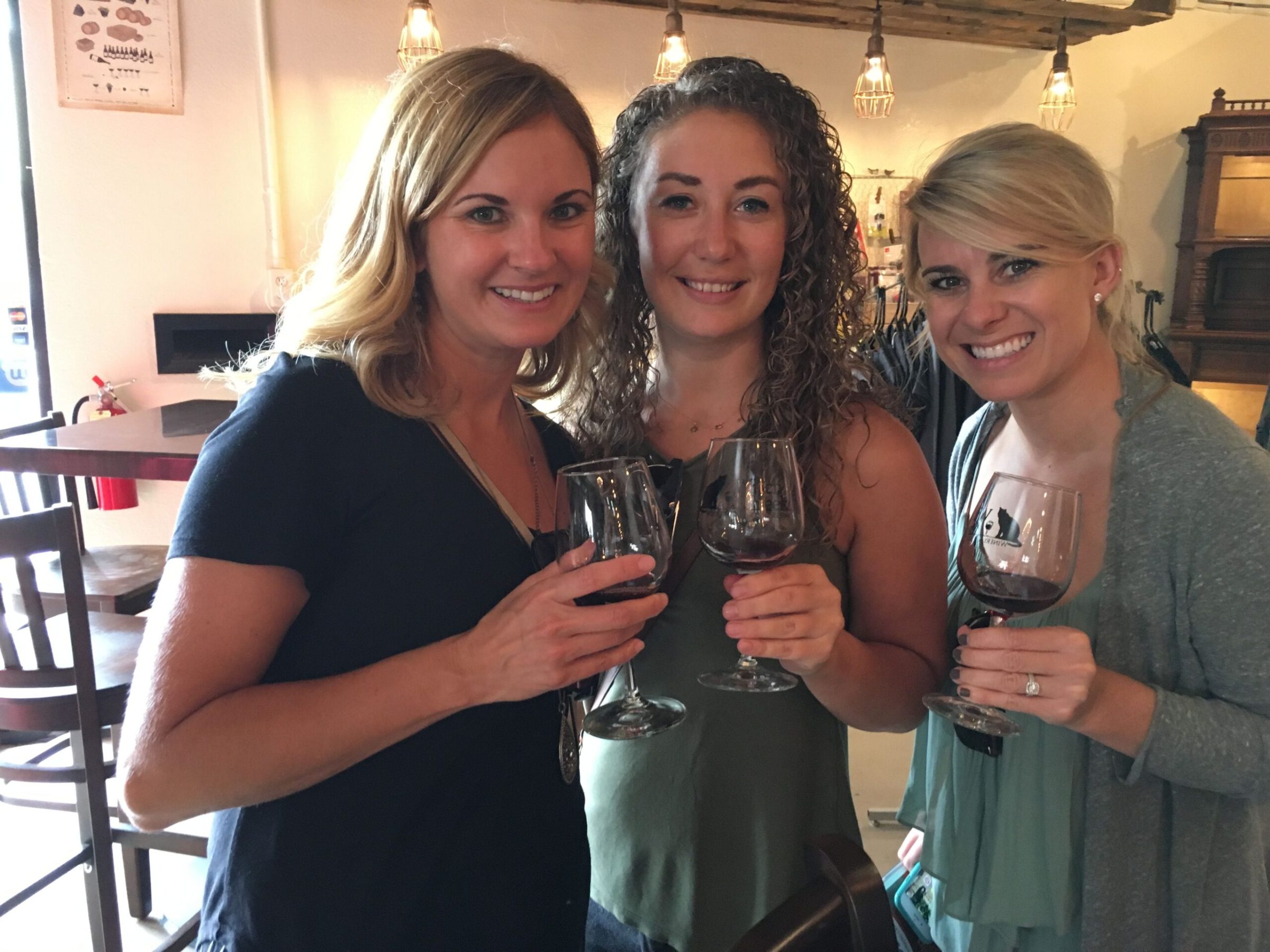 a person holding a wine glass posing for the camera