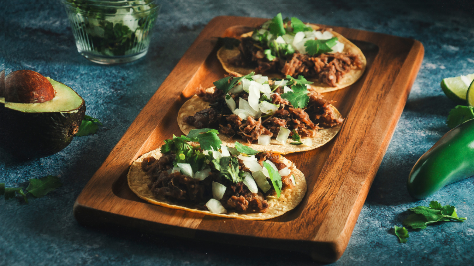 a slice of pizza sitting on top of a wooden cutting board