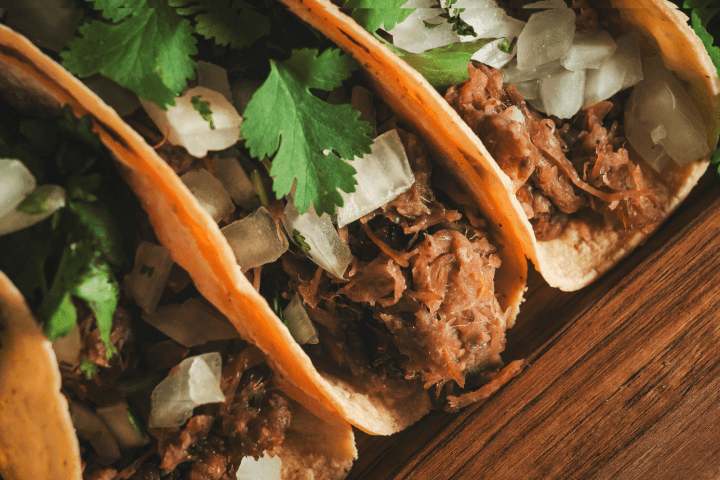 a sandwich sitting on top of a wooden table