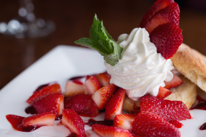 a piece of cake with fruit on a plate