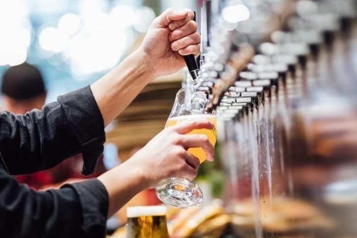 a person holding a wine glass