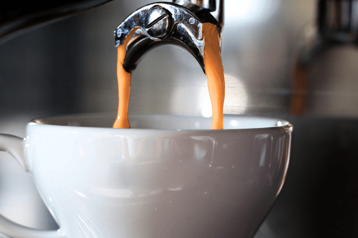 a close up of a coffee cup on a counter