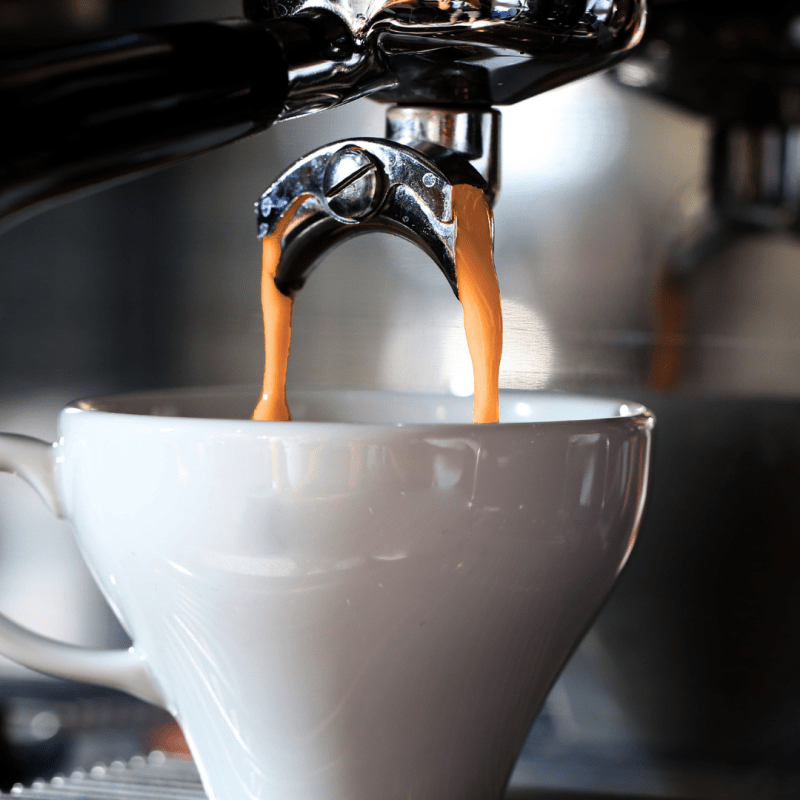 a close up of a coffee cup on a counter