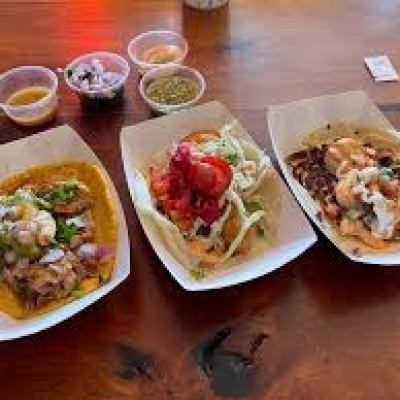 a plate of food sitting on top of a wooden table