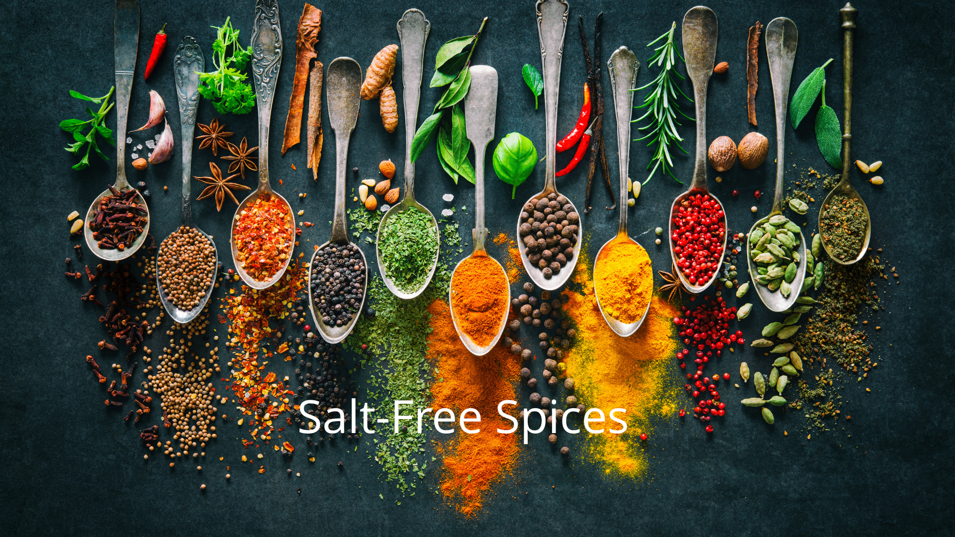 Assorted spices in spoons on dark surface, labeled 'Salt-Free Spices'.