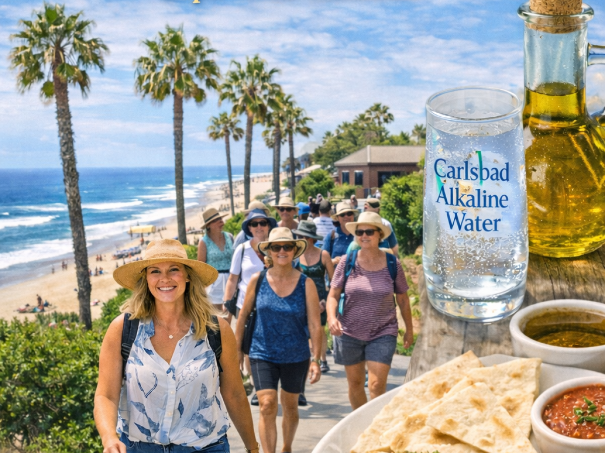 People walking by beach with food, water, and olive oil in foreground. Culinary Fit - Carlsbad Walking Food Tour