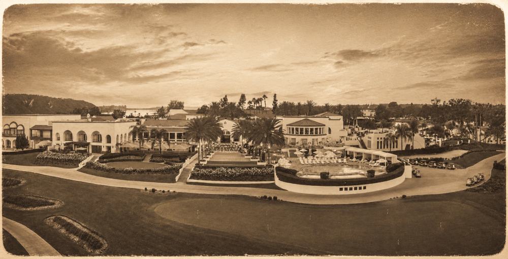 Sepia aerial view of a large, elegant resort with gardens and pathways.