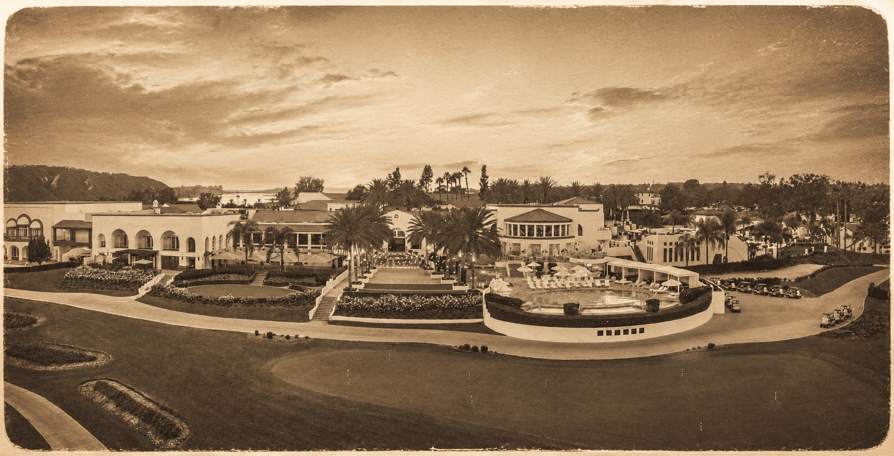 Sepia aerial view of a large, elegant resort with gardens and pathways.